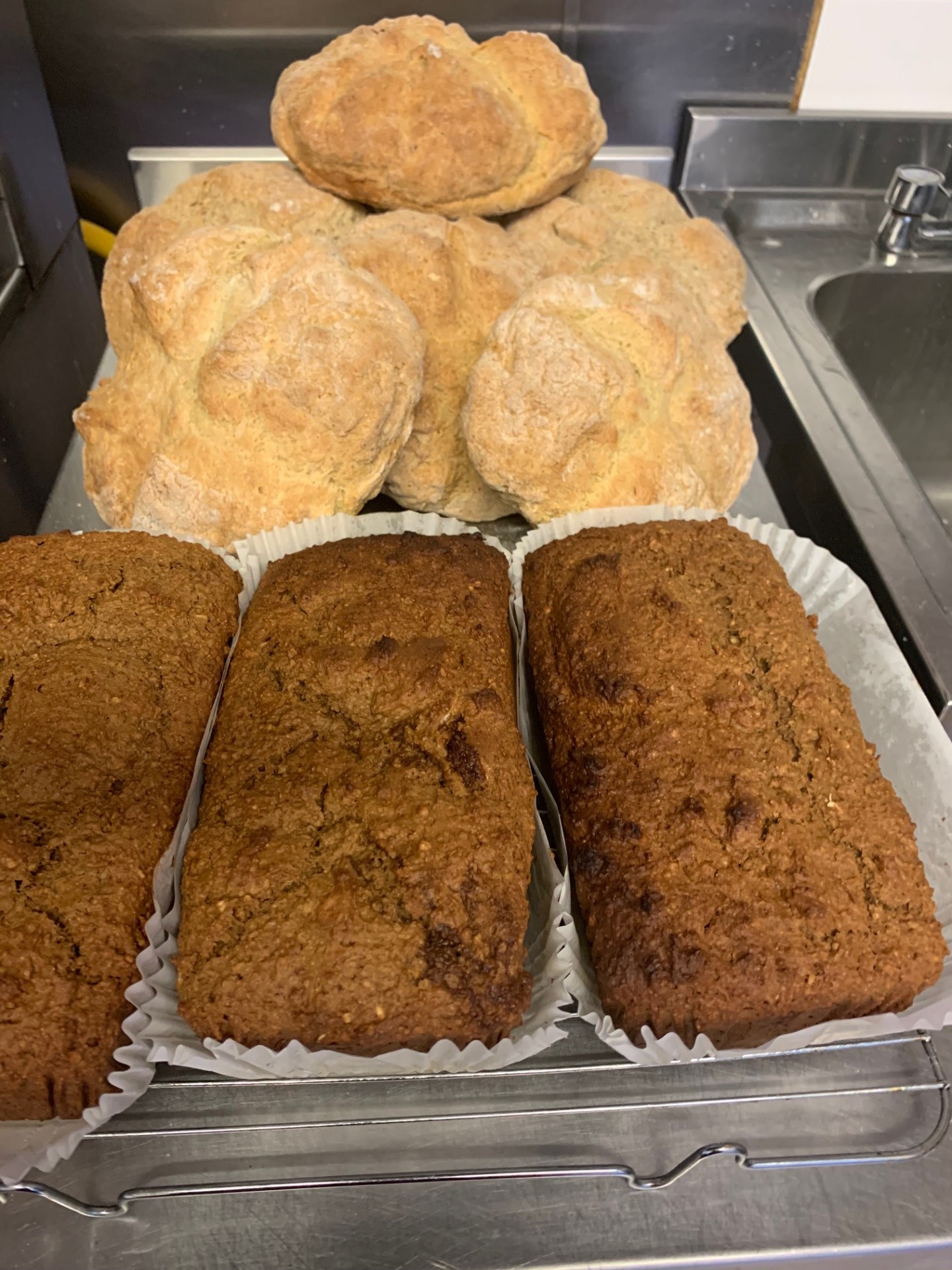 Freshly baked homemade soda bread and brown bread cooling in the Pisces kitchen