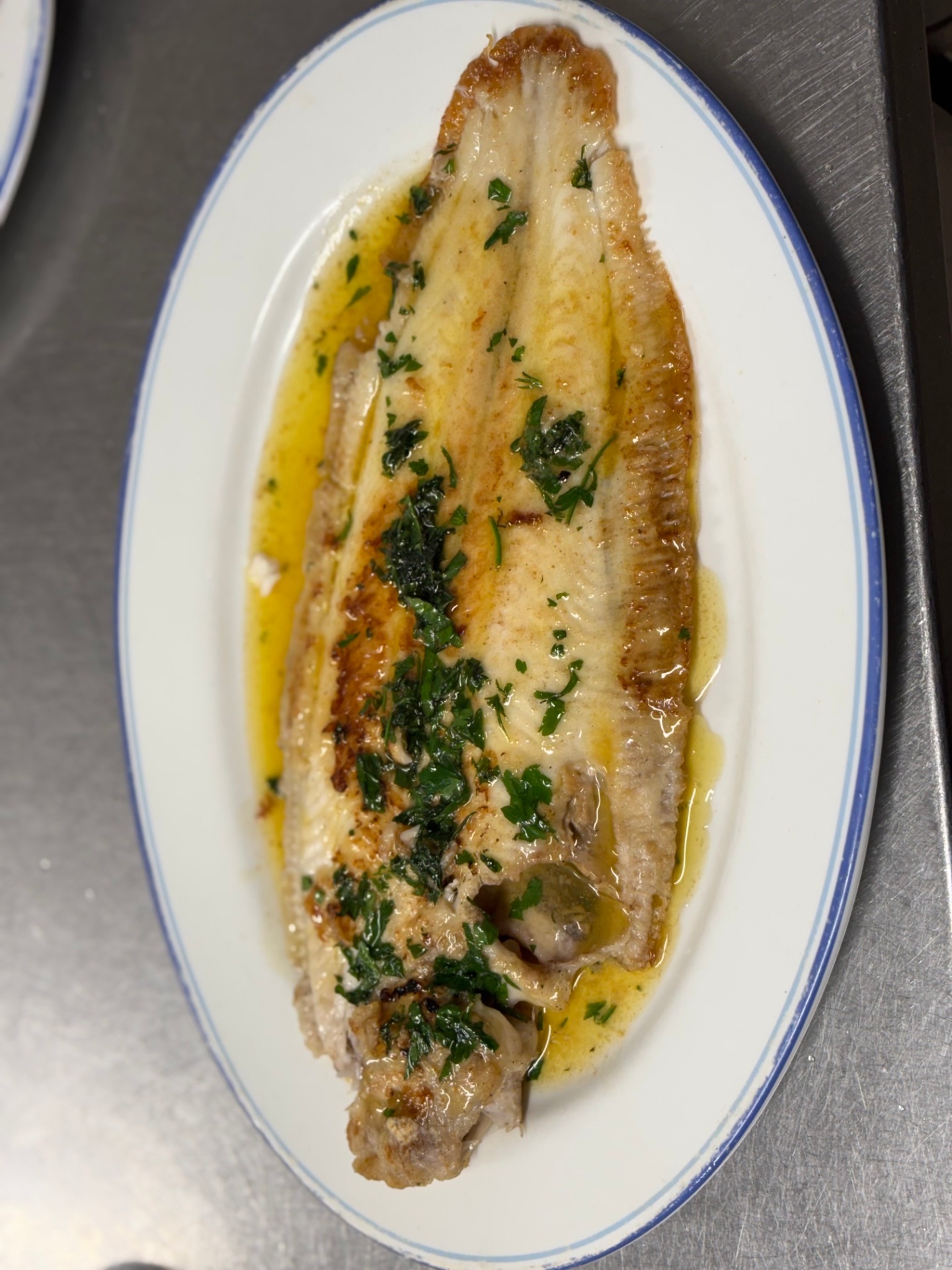 Pan-fried Dover sole finished with parsley butter
