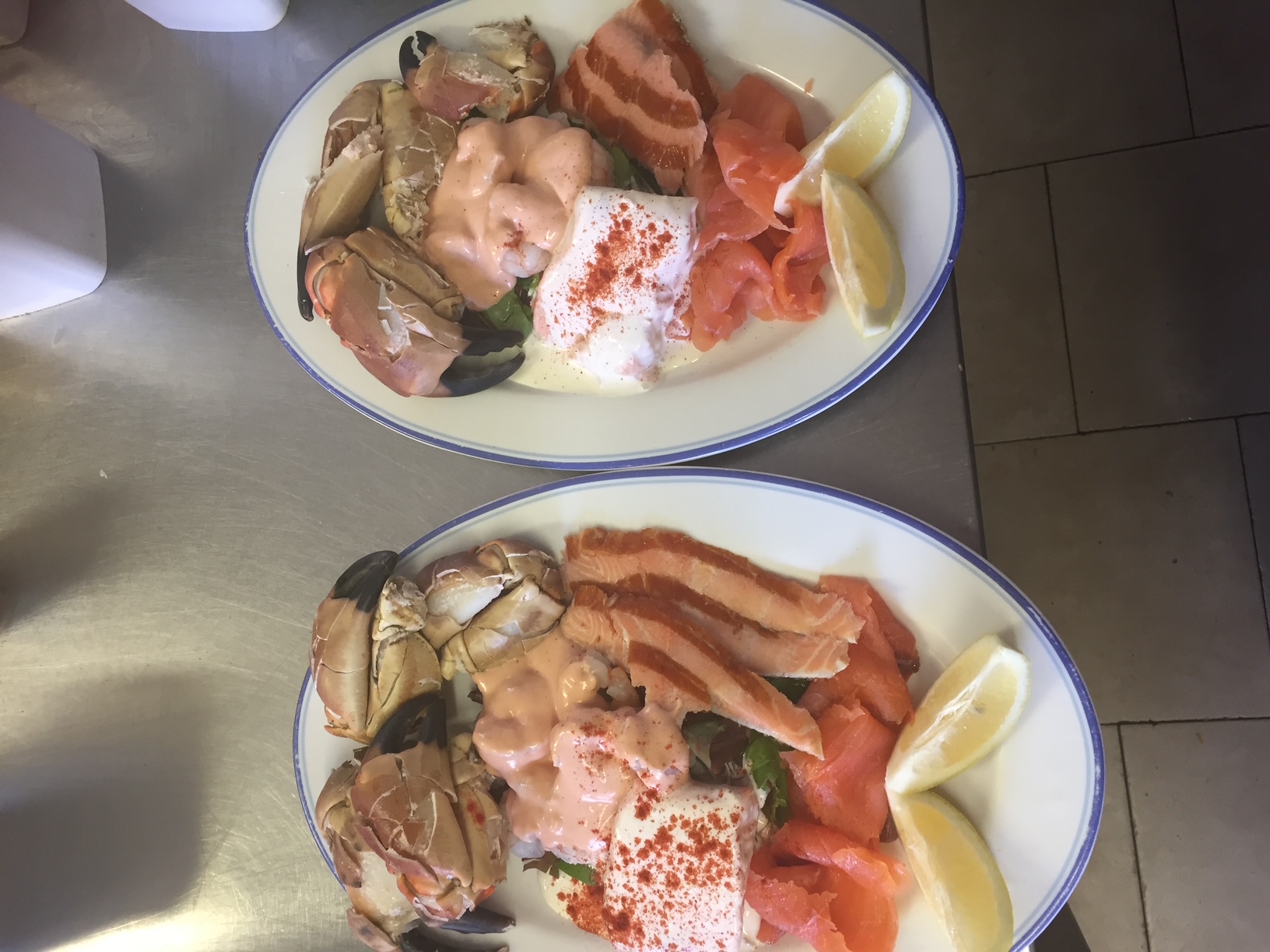 Cold seafood platter with crab claws, prawns, smoked and poached salmon and lemon