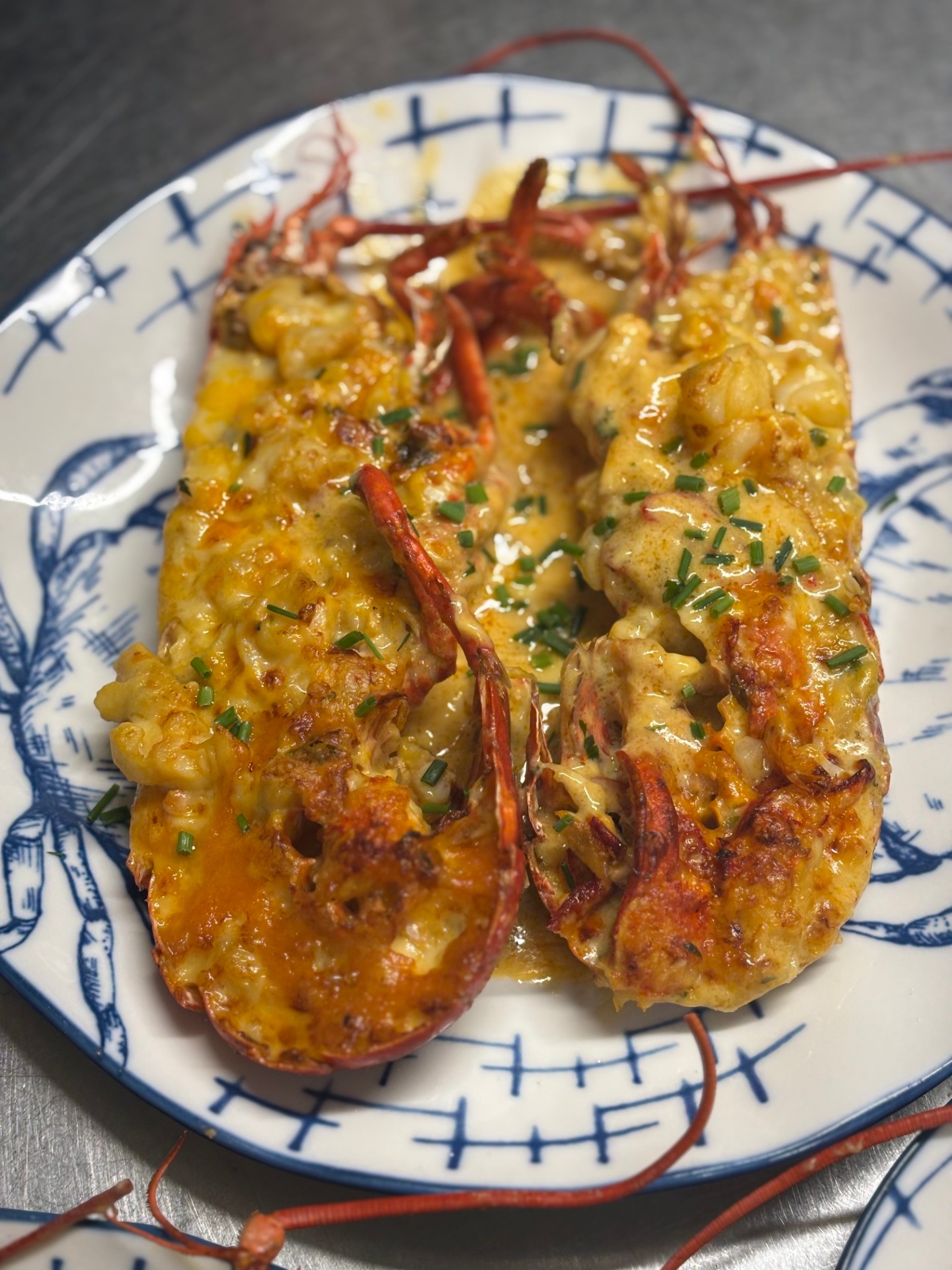 Whole lobster thermidor glazed and finished with fresh chives