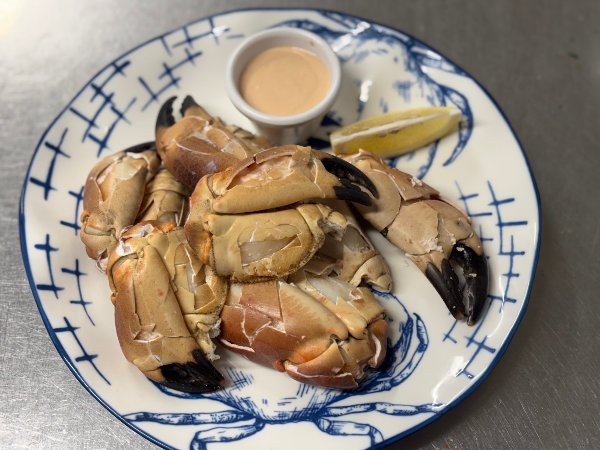 Fresh Maharees crab claws served with marie rose sauce and lemon